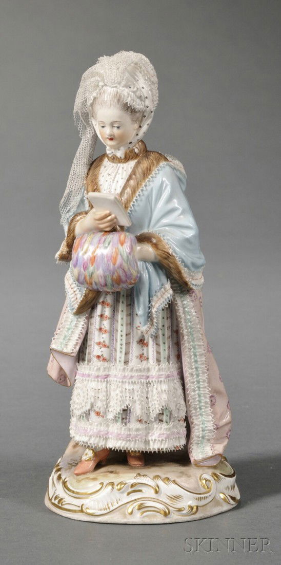 Meissen Porcelain Figure of a Well-dressed Lady, G: Meissen Porcelain Figure of a Well-dressed Lady, Germany, the standing figure carrying a muff and reading a pamphlet, on shaped base, with crossed swords mark, ht. 8 in.