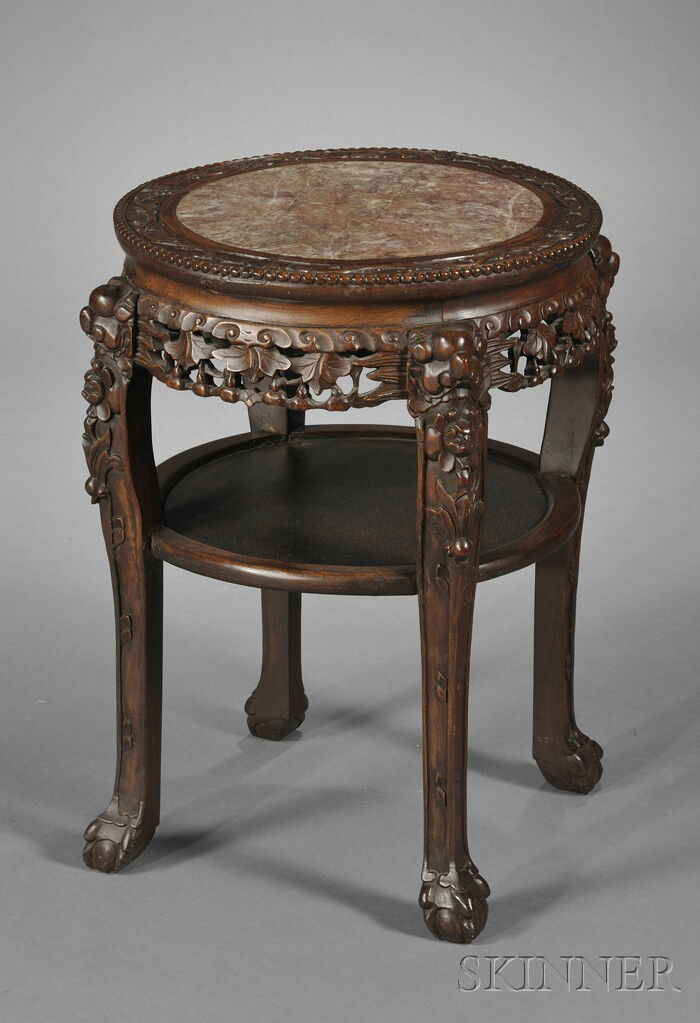 Chinese Export Round Carved Wood Marble-top Table: Chinese Export Round Carved Wood Marble-top Table, 19th century, the rouge marble inset top over an openwork apron carved with a gourd and vine design, medial shelf, and legs with dragon monopodia, ht