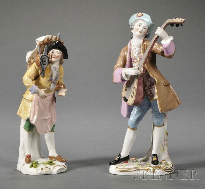 Two Porcelain Figures of Men, 19th century, each: Two Porcelain Figures of Men, 19th century, each polychrome enameled and gilded, one with a peasant carrying a basket and bellows, ht. 9 3/16 in.; the other a gentleman playing the guitar, ht. 10 5/8