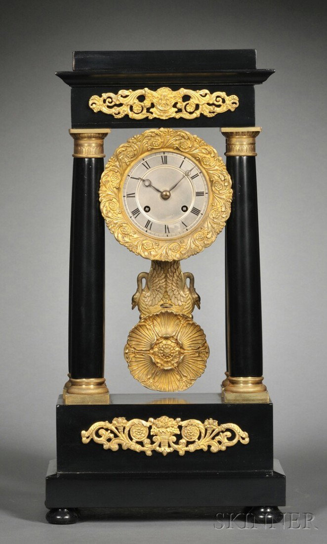Ebonized French Portico Clock, c. 1860, the eboniz: Ebonized French Portico Clock, c. 1860, the ebonized wooden case with ormolu and four columns with cast brass capitals supporting the cornice and flanking the 3 1/2 in. silvered brass dial with Roman