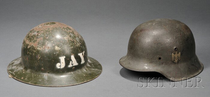 Two Metal Military Helmets, 20th century, one Ger: Two Metal Military Helmets, 20th century, one German with eagle over swastika decal, the other a green-painted helmet with stenciled lettering "JAY."
