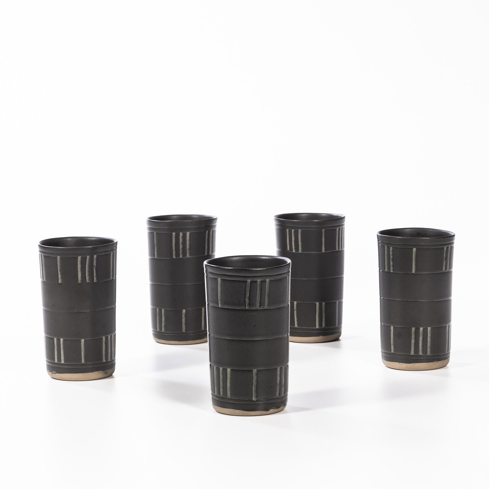 Five Jane and Gordon Martz Marshall Studios Ceramic Beakers, Veedersburg, Indiana, dated 1974,: Five Jane and Gordon Martz Marshall Studios Ceramic Beakers, Veedersburg, Indiana, dated 1974, incised artist's signatures and date, ht. 5 1/2 in. (14 cm.).