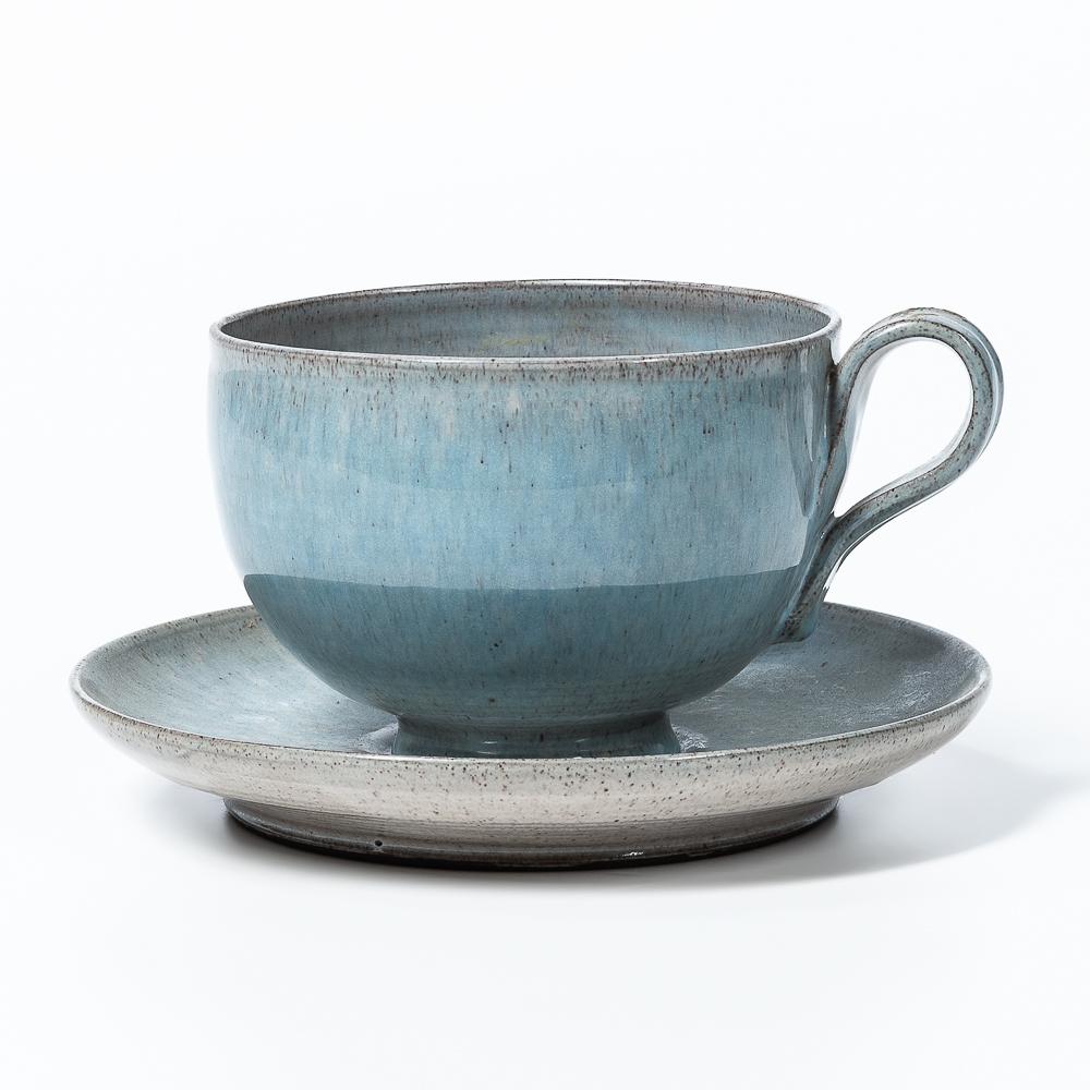 Edwin and Mary Scheier Studio Pottery Cup and Saucer, New Hampshire, signed, cup ht. 3 1/2 in. (8.5: Edwin and Mary Scheier Studio Pottery Cup and Saucer, New Hampshire, signed, cup ht. 3 1/2 in. (8.5 cm), undertray dia. 7 in. (17.5 cm).