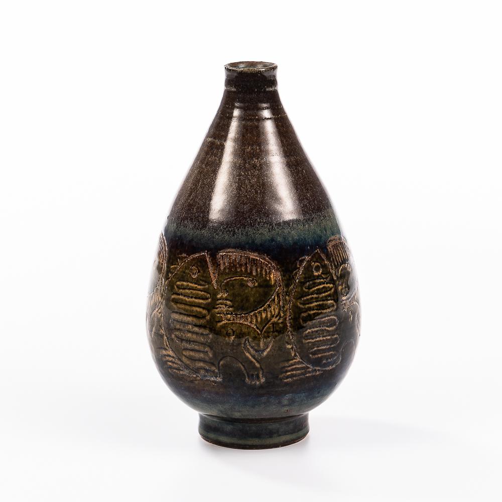 Edwin and Mary Scheier Studio Pottery Bottle Vase, New Hampshire, incised decoration depicting: Edwin and Mary Scheier Studio Pottery Bottle Vase, New Hampshire, incised decoration depicting conjoined women and fish, signed, ht. 7 in. (17.5 cm).