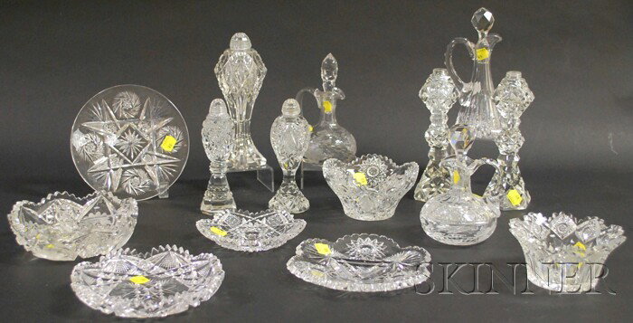 Thirteen Pieces of Colorless Cut Glass Tableware, : Thirteen Pieces of Colorless Cut Glass Tableware, five salt shakers including a pair, three cruets, two small bowls, a condiment dish, and two dishes.