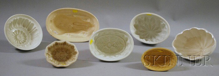Seven Ceramic Culinary Molds, with shapes includi: Seven Ceramic Culinary Molds, with shapes including two floral, corn, a rabbit, and three designs.