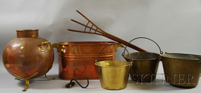 Seven Wood and Metal Decorative and Domestic Item: Seven Wood and Metal Decorative and Domestic Items, an oak hay fork, iron bale hook, a copper boiler, three brass kettles with iron swing handles, and a brass-mounted copper vessel.
