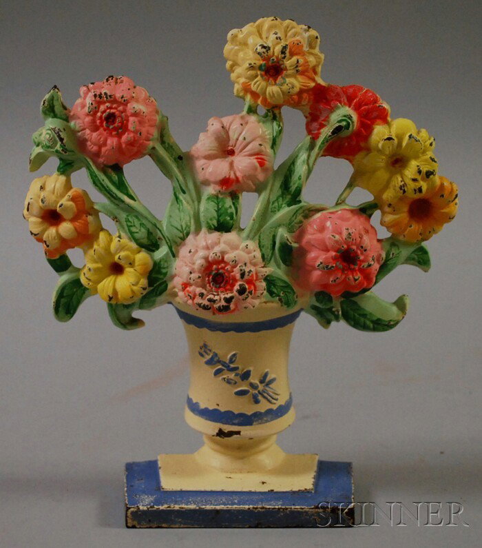 Painted Cast Iron Vase of Flowers Doorstop.: Painted Cast Iron Vase of Flowers Doorstop.