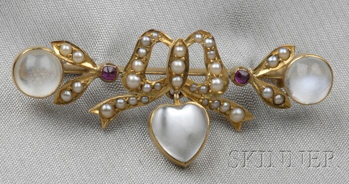 Art Nouveau 18kt Gold, Moonstone, and Seed Pearl P: Art Nouveau 18kt Gold, Moonstone, and Seed Pearl Pin, designed as a seed pearl bow with cabochon moonstone terminals, suspending a cabochon moonstone heart, cushion-cut ruby accents, lg. 1 1/2 in.