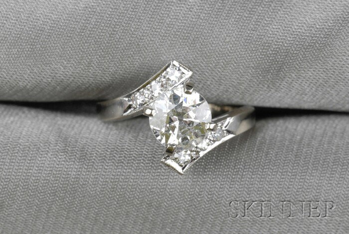 Diamond Solitaire, prong-set with an old European-: Diamond Solitaire, prong-set with an old European-cut diamond weighing approx. 1.25 cts., 14kt gold bypass mount with single-cut diamond melee accents, size 5 1/4.