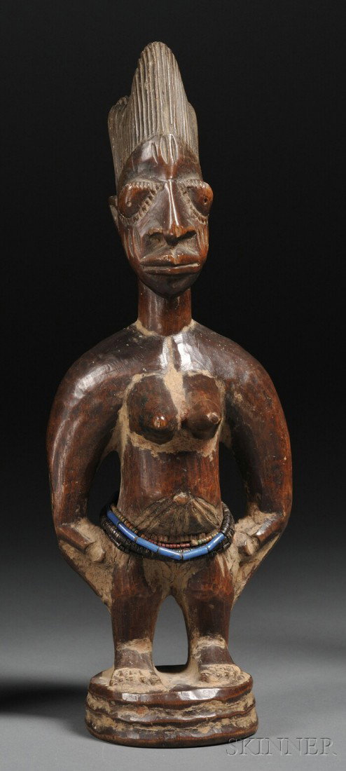Yoruba Carved Wood Ibeji, the female form with hand: Yoruba Carved Wood Ibeji, the female form with hands to the hips, incised coiffure, beaded strands at waist, ht. 12 in.
