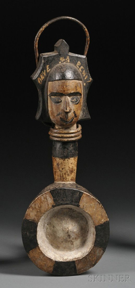 Igbo Carved Wood Chalk Bowl, "Okwa Nzu," the handle: Igbo Carved Wood Chalk Bowl, "Okwa Nzu," the handle with wrapped iron, painted with black and white pigments, ht. 17 in.