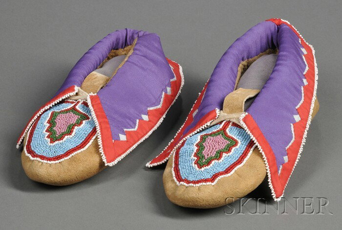 Delaware Beaded Hide Moccasins, c. 1930s, by Minni: Delaware Beaded Hide Moccasins, c. 1930s, by Minnie Fouts, with abstract foliate beadwork on the vamps, and silk applique cuffs, lg. 10 in. Provenance: Dr. Frank T. Siebert Collection.