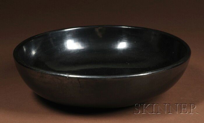 San Ildefonso Polished Black Bowl, signed "Marie a: San Ildefonso Polished Black Bowl, signed "Marie and Julian", c. 1930's, (minor flaws), ht. 2 3/4, dia. 10 in. Provenance: Property of a Western Museum.
