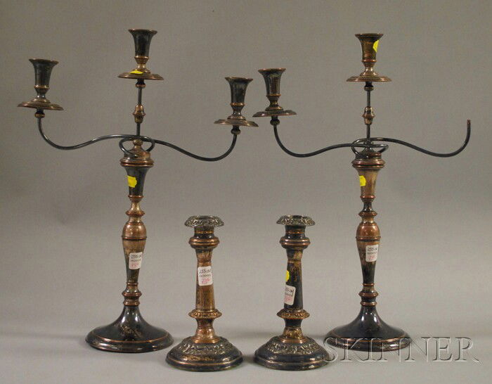 Group of Silver-plated Convertible Candelabra and: Group of Silver-plated Convertible Candelabra and Candlesticks, a pair of convertible candelabra and a pair of candlesticks, (one candleholder missing from one candelabra arm), candelabra ht. 16 1/2 i