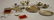 321A: Group of Miniature Silver Tableware, including tw