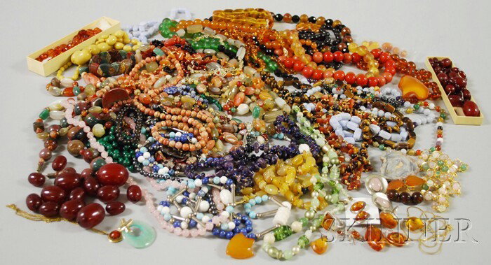 Large Group of Mostly Beaded Stone Necklaces. incl: Large Group of Mostly Beaded Stone Necklaces. including amber, malachite, tiger's-eye, rose quartz, amethyst, hematite, agate, and carnelian.