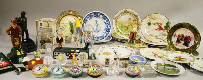 Collection of Golfing-theme Collectibles and Items: Collection of Golfing-theme Collectibles and Items, including eighteen ceramic plates, a pitcher, and two figures, a painted cast iron doorstop and mechanical bank, twelve glass paperweights, two enam