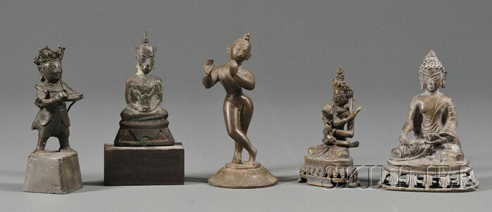 Five Bronze Divinities, two from Nepal, a Thai seat: Five Bronze Divinities, two from Nepal, a Thai seated Buddha, a figure of Krishna, and a standing figure of Kuan Ti from China, ht. to 7 in.