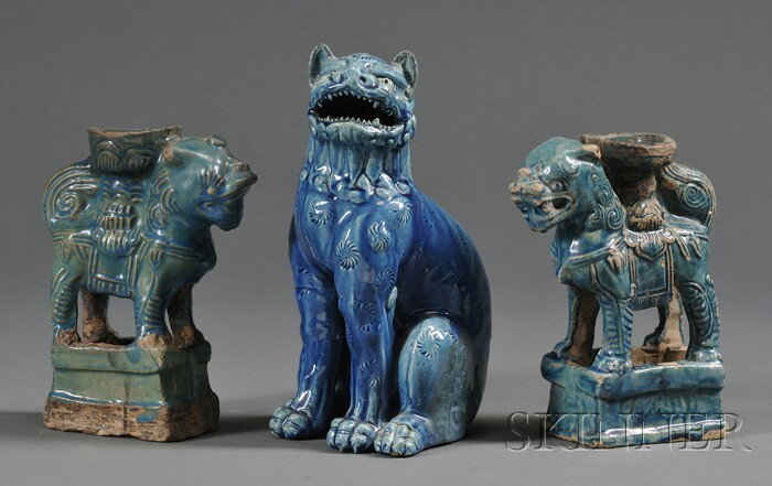 Three Turquoise Glazed Pottery Figures, 19th centu: Three Turquoise Glazed Pottery Figures, 19th century, a Japanese lion and a pair of lamp stands in the form of Buddhist lions, ht. 10 and 7 3/4 in., respectively.