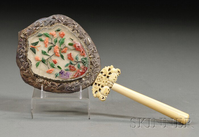 Decorated Mirror, China, 19th century, ivory handl: Decorated Mirror, China, 19th century, ivory handle, base silver plaque inlaid with a hardstone panel, inset with a flowering tree in coral, malachite, amethyst, and carnelian, lg. 10 in.