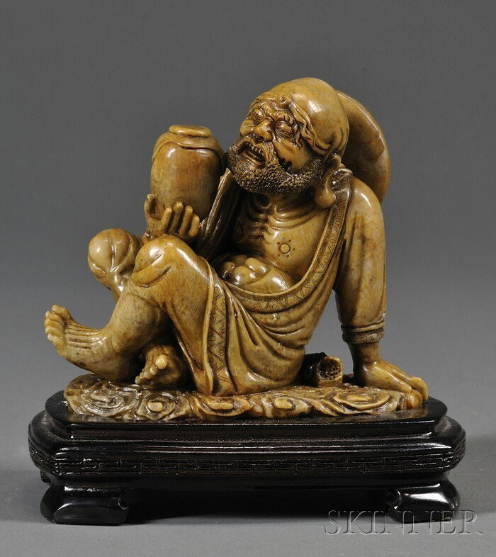 Soapstone Carving, China, finely carved as the sea: Soapstone Carving, China, finely carved as the seated drunk figure of Luohan holding a wine jar, wood stand, ht. 5 in.