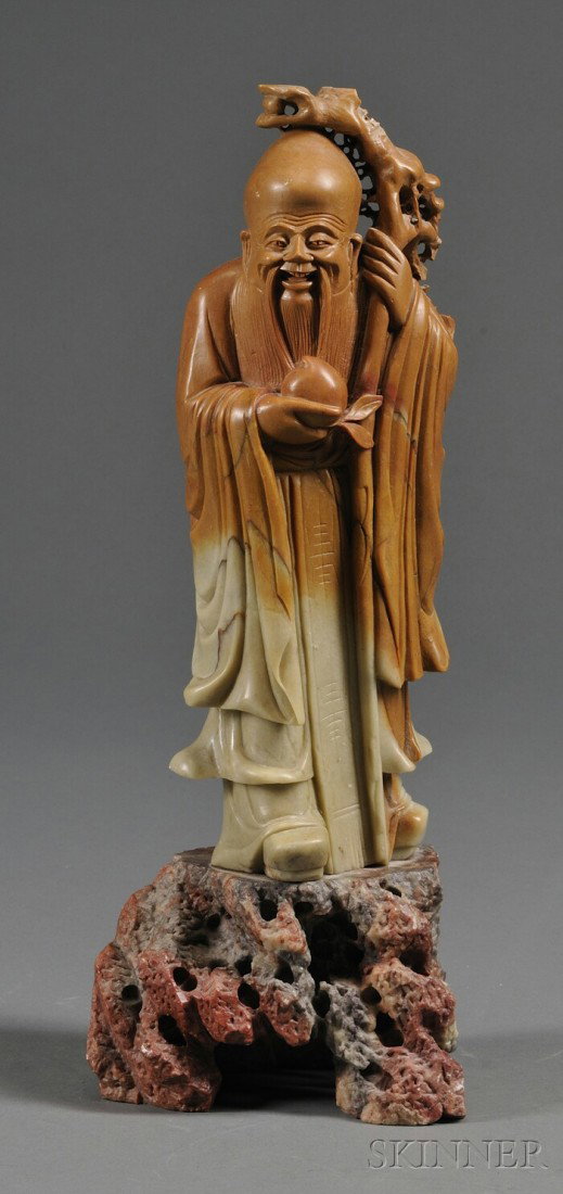 Carved Soapstone Figure, China, early 20th century: Carved Soapstone Figure, China, early 20th century, figure of a Shao Lao holding a staff and a peach, ht. excluding carved stand 11 in.