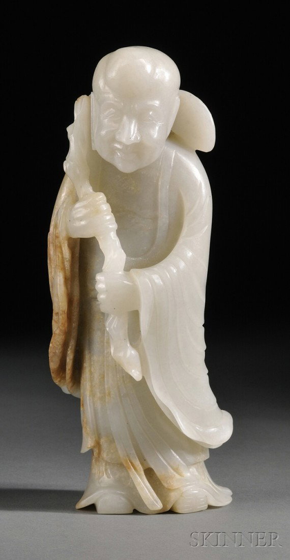 Jade Carving, China, standing figure of a Luohan w: Jade Carving, China, standing figure of a Luohan with a branch of ling chih, stone of a pale grey color with tan markings, ht. 6 1/4 in.