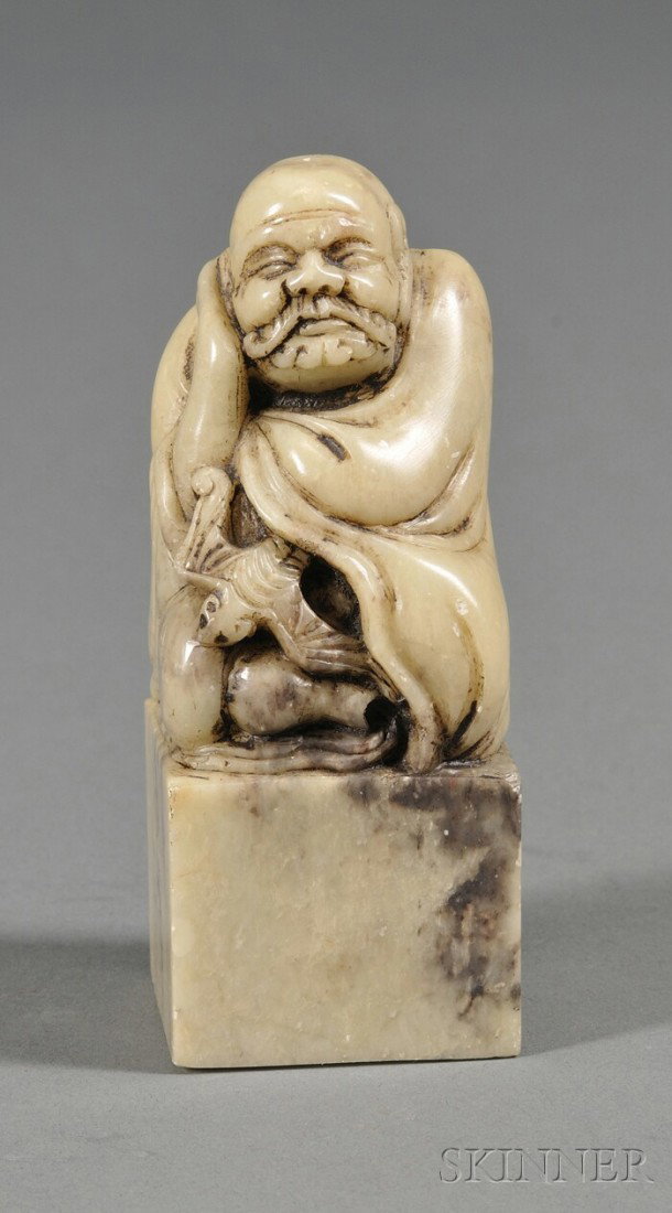 Soapstone Seal, China, late 19th century, finial c: Soapstone Seal, China, late 19th century, finial carved as a Luohan with a hat, inscription removed.