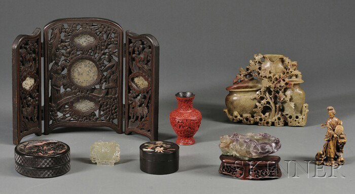 Eight Chinese Works, 19th/20th century, including: Eight Chinese Works, 19th/20th century, including two boxes: one of black on red carved cinnabar and one with inlay; a cinnabar vase, four stone carvings: a soapstone female figure, a soapstone vase,