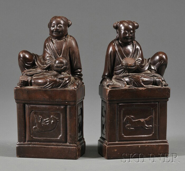 Pair of Soapstone Seals, China, early 20th century: Pair of Soapstone Seals, China, early 20th century, finials in the form of children, bases with relief horses, (losses), ht. 8 1/2 in.
