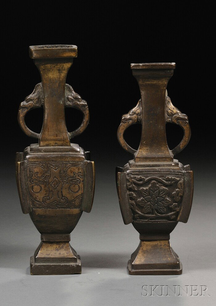 Two Bronze Vases, China, 19th century or earlier, : Two Bronze Vases, China, 19th century or earlier, square form with flanges and animal mask handles, traces of surface gilt, ht. 7, 7 3/4 in., respectively.