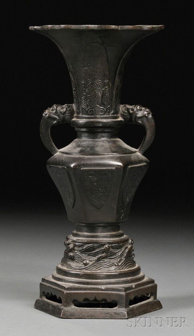 Bronze Vase, China, 19th century or earlier, tsun: Bronze Vase, China, 19th century or earlier, tsun-form with a foliated mouth and animal mask handles, ht. 10 in.