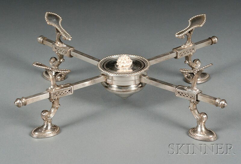 George III Silver Dish Cross, London, 1770, maker: George III Silver Dish Cross, London, 1770, maker likely John Neville, burner with beaded rim, uprights and legs with openwork styled shell-form supports, lg. 11 3/8 in., approx. 10.2 troy oz.; sold t