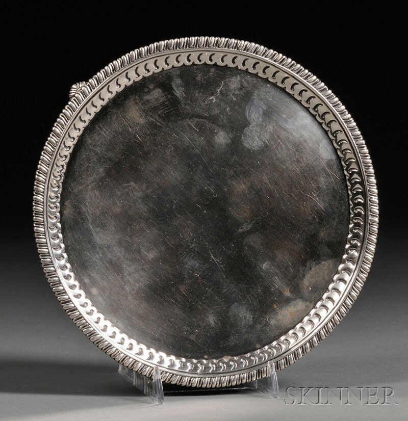 George III Silver Salver, London, 1773, John Carte: George III Silver Salver, London, 1773, John Carter, maker, with ovolo and gadrooned rim, on three gadrooned pad feet, dia. 7 5/8 in., approx. 11 troy oz.