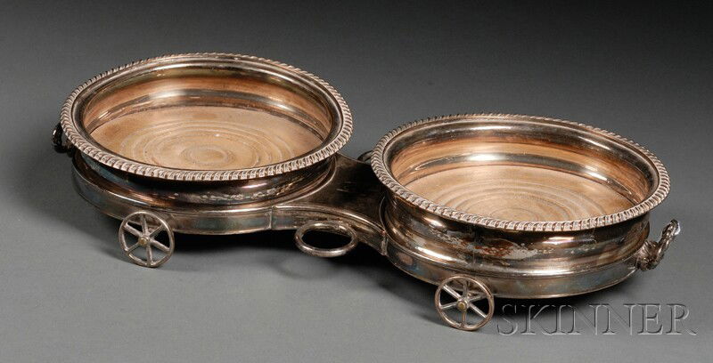 English Silver Plate Two-bottle Decanter Trolley,: English Silver Plate Two-bottle Decanter Trolley, 19th century, the figure-eight-shaped trolley base with short handles, and working wheels, fitted with pair of removable wine coasters with wooden bas