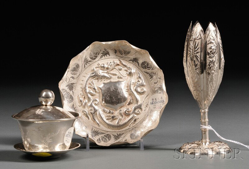 Three Chinese Export Silver Tablewares, 20th centu: Three Chinese Export Silver Tablewares, 20th century, comprising a floriform bud vase with bamboo-form stem, ht. 6 1/8, a lidded condiment bowl with underplate, engraved with dragons and characters, h