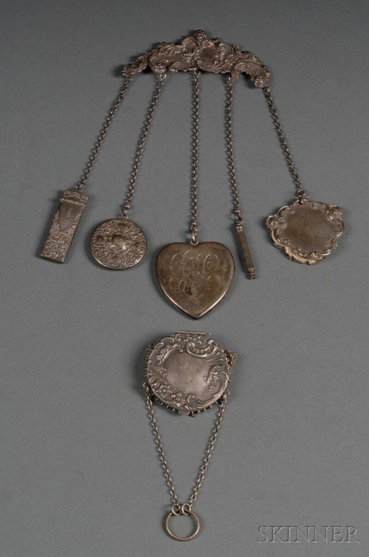 American Victorian Sterling Chatelaine, late 19th: American Victorian Sterling Chatelaine, late 19th century, Rococo Revival brooch-form body suspending five oval link chains holding sterling Renaissance Revival notepad with celluloid pages, a retract