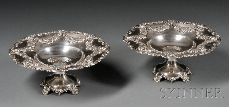 Pair of Theodore B. Starr Renaissance Revival Ste: Pair of Theodore B. Starr Renaissance Revival Sterling Tazzas, c. 1900, the dish decorated with jester masks conjoined by fruiting grape vine swags, with S-scroll rim, on trumpet foot with C-scroll an