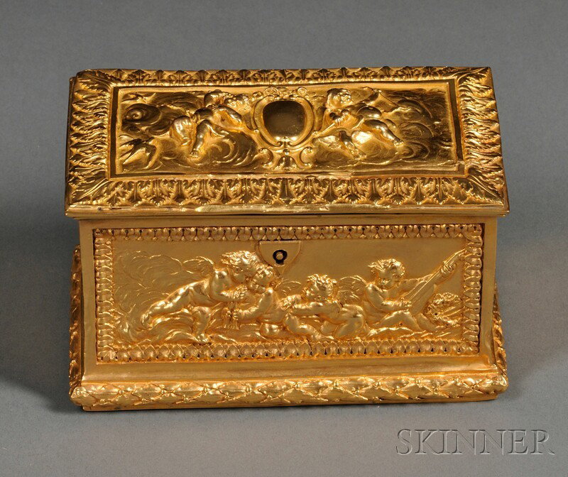 Dore Bronze Box, France, 19th century, casket-form: Dore Bronze Box, France, 19th century, casket-form, with all-over repousse decoration of putti at various pursuits, the hinged lid with two putti centering a vacant cartouche, with lock and key, 3 1/4