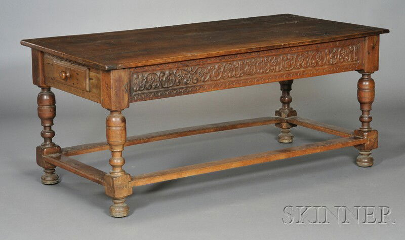 English Jacobean-style Tavern Table, the rectangul: English Jacobean-style Tavern Table, the rectangular top over grapevine carved apron with two drawers, on turned legs joined by stretches, ht. 30 1/4, wd. 69 1/2, dp. 34 1/2 in.