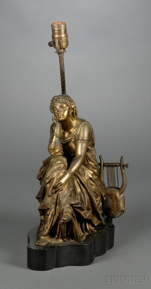 Figural Bronze Lamp Base, 19th century, modeled a: Figural Bronze Lamp Base, 19th century, modeled as a classical Muse seated with a lyre at her back, mounted atop an ebonized wood base, ht. 13 1/4 in.