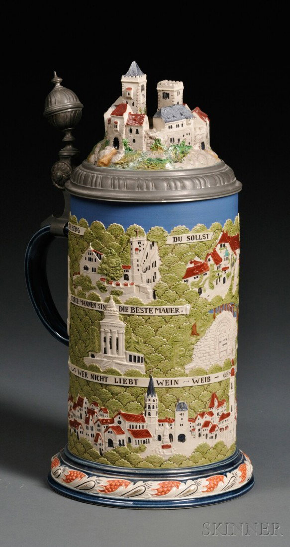 Large Mettlach Stein of Wartburg, Germany, 19th c: Large Mettlach Stein of Wartburg, Germany, 19th century, with topographical view inlaid to pewter lid with filet ball thumbpiece, with the town in full color relief around the body, number 2824, vol. 