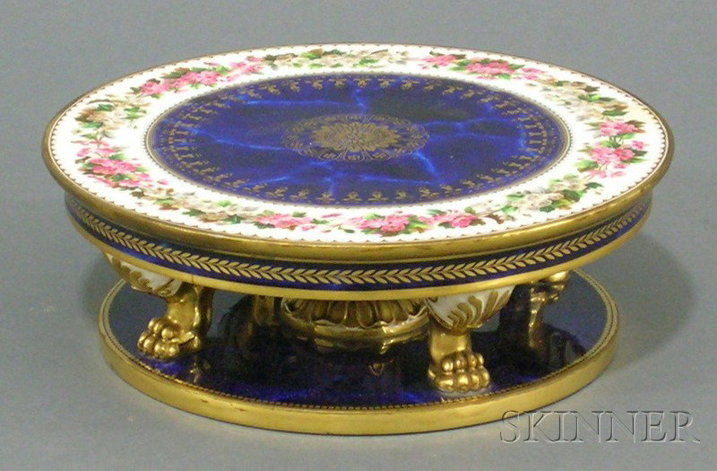 Sevres Painted and Gilded Cobalt Blue Porcelain C: Sevres Painted and Gilded Cobalt Blue Porcelain Cake Stand, c. 1833, circular top painted to the interior with mottled blue polychrome foliate borders, leaftip gilded edge, on anthemion-molded legs en