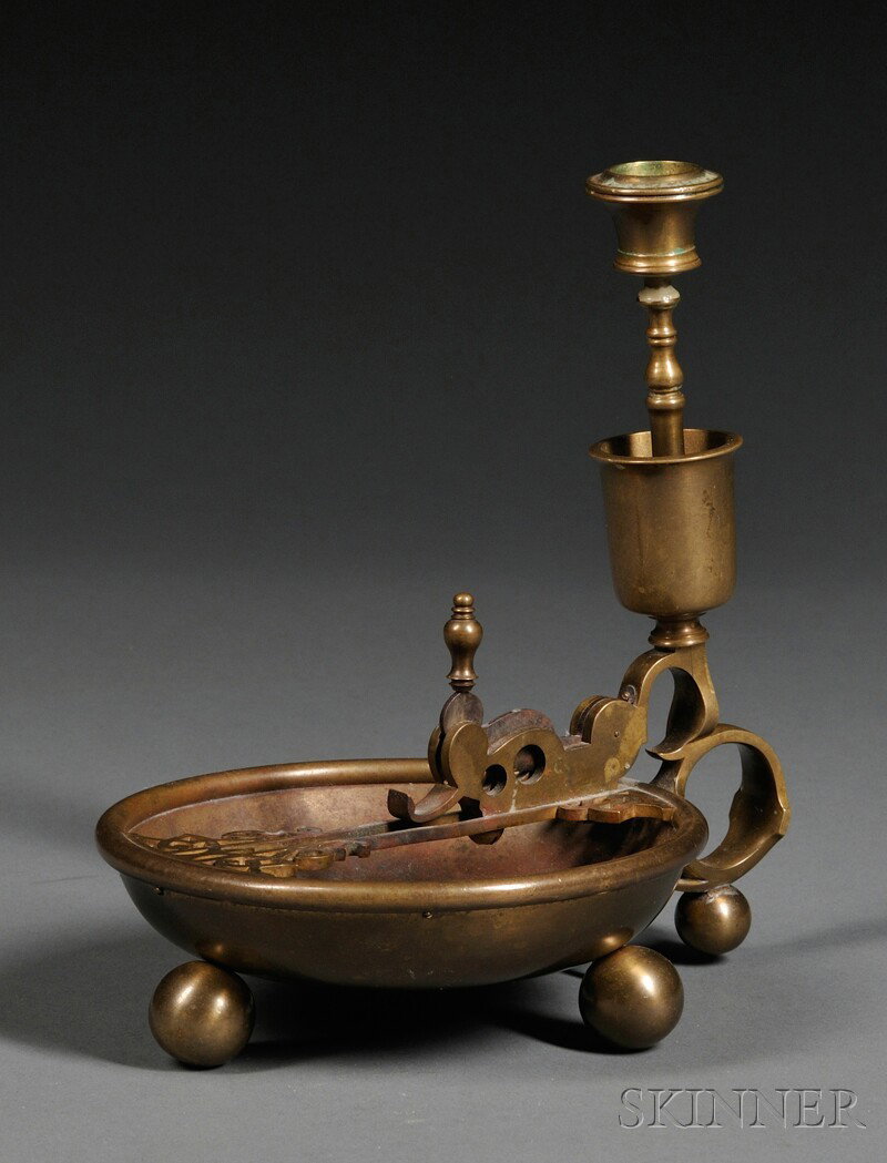 Brass Cigar Cutter, Continental, 19th century, th: Brass Cigar Cutter, Continental, 19th century, the handle with mounted candlestick, the cutter fitted atop a three legged ashtray, ht. 7 3/4 in.