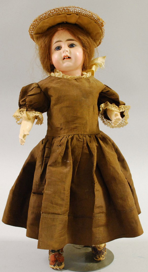 Gebruder Kuhnlenz Bisque Head Doll, Germany, straw: Gebruder Kuhnlenz Bisque Head Doll, Germany, straw hat, wood and composition jointed body, ht. 16 in.