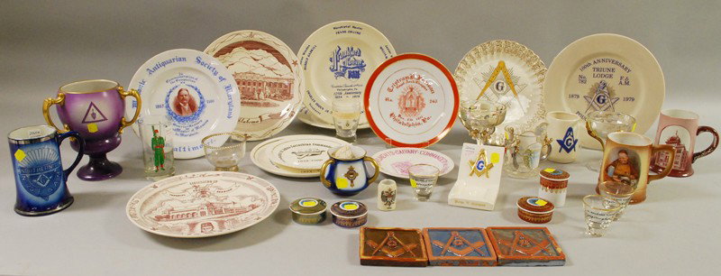 Large Group of Assorted Masonic Ceramic and Glassw: Large Group of Assorted Masonic Ceramic and Glassware, including three Moravian tiles, two gilt-handled trophies, four small Pomerode Leart lidded boxes, plates, toasting glasses, mugs, and other item
