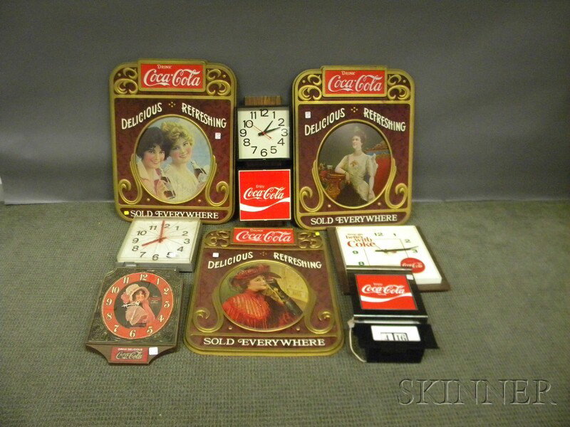 Six Coca-Cola Plastic Wall Clocks and a Three Coca: Six Coca-Cola Plastic Wall Clocks and a Three Coca-Cola Vintage-style Plastic Portrait Wall Plaques.