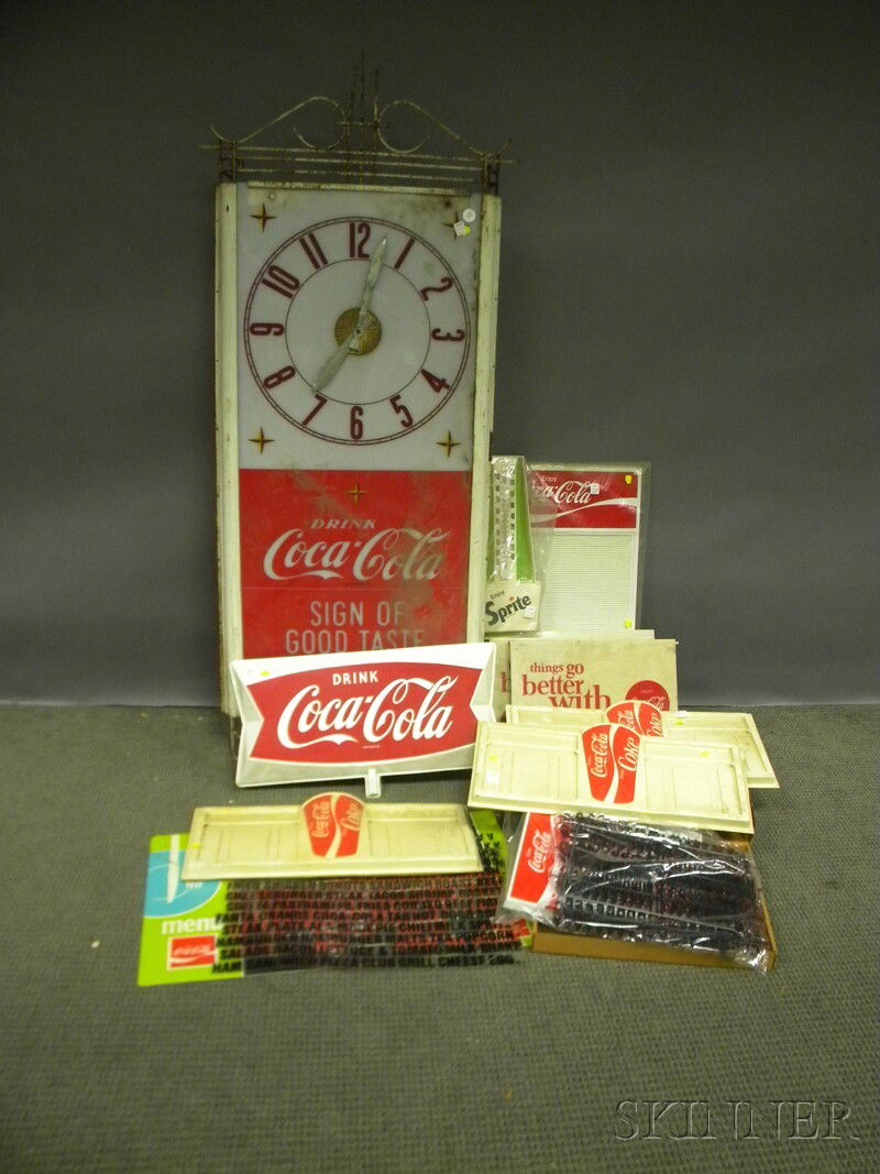 Lot of Coca-Cola Mostly Plastic Menu Boards, Disp: Lot of Coca-Cola Mostly Plastic Menu Boards, Display Items, and a Large Wall Clock, c. 1970, with some accessories and parts.