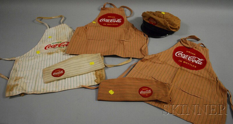 Six Coca-Cola Vendor's Clothing Items, 1960s, two : Six Coca-Cola Vendor's Clothing Items, 1960s, two aprons, a hat, cap, and an apron with hat, with patches.